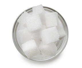 Bowl with refined sugar cubes on white background
