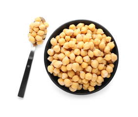 Bowl and spoon with chickpeas on white background