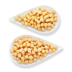 Plates with chickpeas on white background