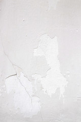 Light wall with white paint peeling off texture in grey and white tone. Copy space. Background for design.