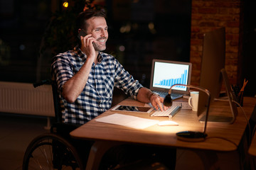 Disabled businessman working in office