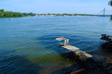 Beautiful view of the wide river in the city in the spring.