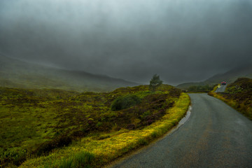 Scenic Single Track Road Through Hills On Isle Of Skye In Scotland