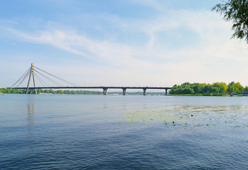 View across the river on the big bridge in the city.