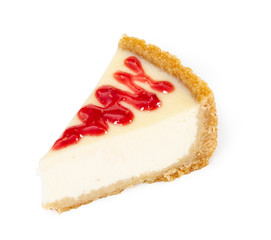 Piece of cheesecake with raspberry jam isolated on white