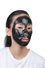 Asian woman with black spa mask