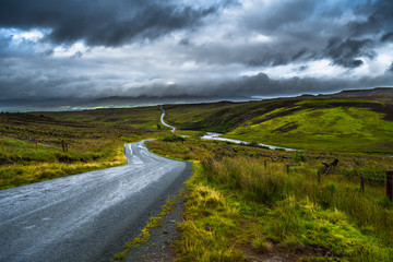 Abandoned Single Track Road Through Scenic Hills On The Isle Of Skye In Scotland