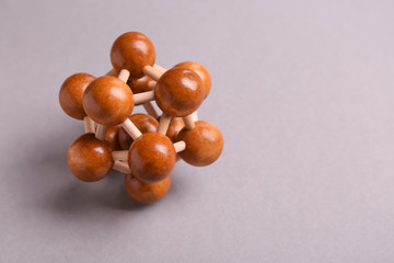Wooden puzzle on grey background