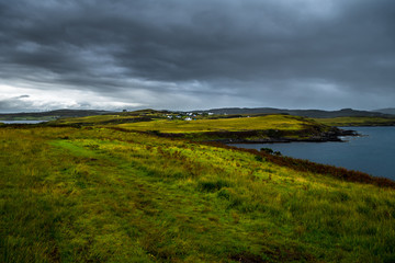 Fototapeta na wymiar Scenic Village At Atlantic Coast On The Isle Of Skye In Scotland