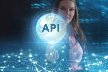 The concept of business, technology, the Internet and the network. A young entrepreneur working on a virtual screen of the future and sees the inscription: API