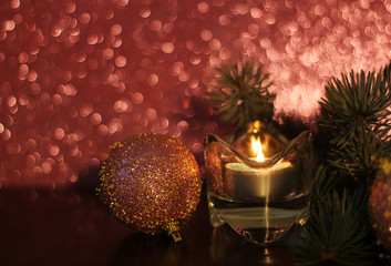 Dark pink Christmas decoration, pine, candle and Christmas ornaments, glitter, bokeh background