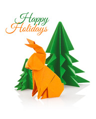 Bunny and green christmas trees of origami.