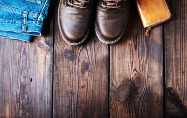 pair of leather brown shoes, wallet and jeans