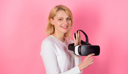 Excited smiling businesswoman wearing virtual reality glasses. Woman watching virtual reality...