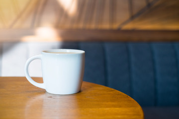 A cup of Coffee on wooden table , wood background 