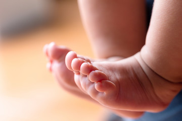 Fototapeta na wymiar Closeup newborn baby's foot
