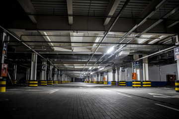 Underground illuminated parking with no people and stripped elements