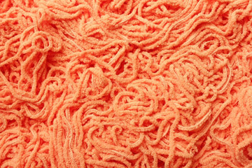 orange background with texture of yarn for knitting