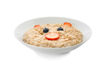 Plate with creative oatmeal for children on white background