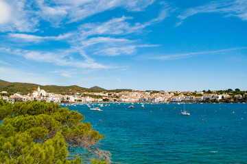 Naklejka na ściany i meble Sea landscape with Cadaques, Catalonia, Spain near of Barcelona. Scenic old town with nice beach and clear blue water in bay. Famous tourist destination in Costa Brava with Salvador Dali landmark