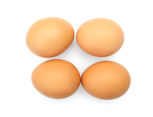 Raw chicken eggs on white background