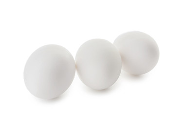 Raw chicken eggs on white background