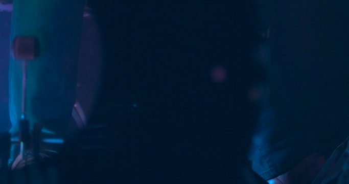 View of a Drummers Feet through the Kick Drum as they Play