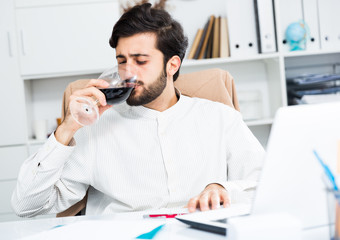 Manager with glass of wine