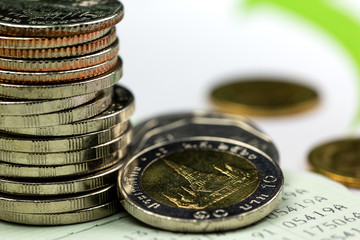 Stack of coins on account book
