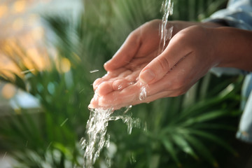 Woman washing hands, closeup