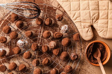 Tasty chocolate truffles on light table