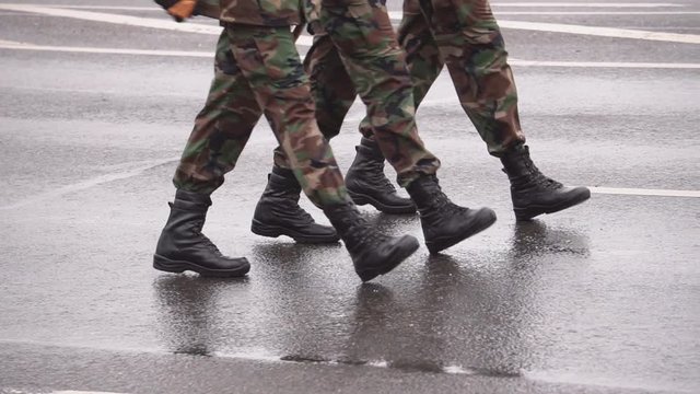 Troops marching at military parade of 100 year aniversary of Lithuanian army