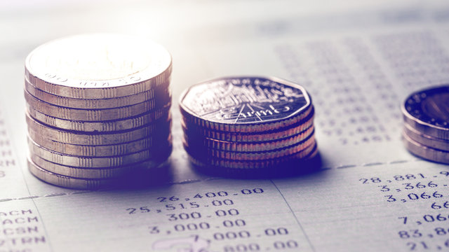 Stack of coins on account book
