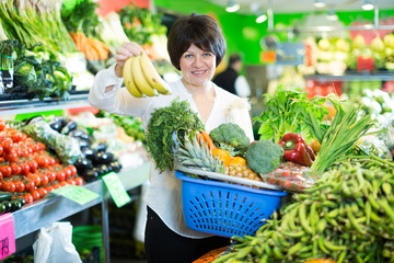 Adult female taking fruits and vegetables