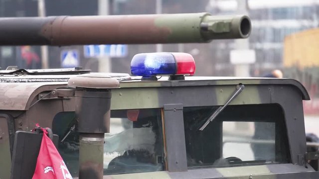 Military police (MP) armored car with emergency lights on, Lithuania, Vilnius