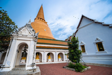 Fototapeta na wymiar Wat Phra Pathom Chedi in blue sky, Thailand. Golden stupas.