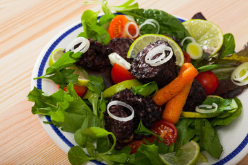 Appetizing black pudding with rice