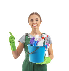 Woman with cleaning supplies on white background