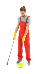 Man with dust pan and floor brush on white background