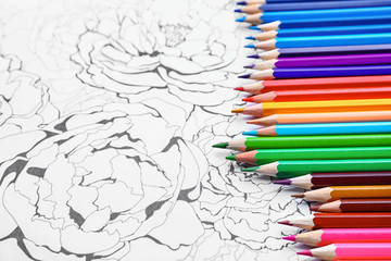 Pencils on adult anti stress coloring picture, closeup
