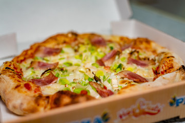 A delicious vegetables pizza in a box ready to be served