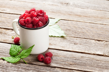 Cup of ripe raspberries