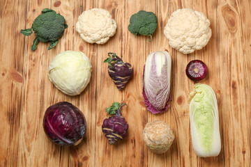 Different fresh vegetables on wooden table
