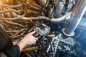 Inspection of a gas turbine engine using a Video Endoscope. Search for defects inside the turbine...
