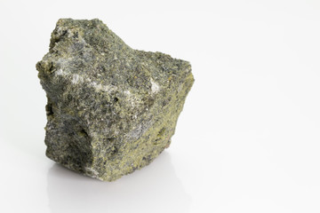 Vesuvianite, also known as idocrase, is a green, brown, yellow, or blue silicate mineral from Vesuvius volcano, isolated on a white background, Naples, Italy