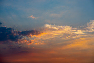 Sky and clouds reflected sunset light.