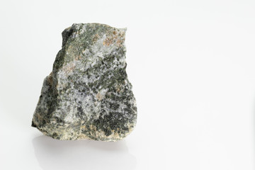 The pyroxenes are a group of important rock-forming inosilicate minerals stone, from Vesuvius volcano, isolated on a white background, Naples, Italy