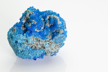Covellite (covelline): rare blue copper sulfide mineral with the formula CuS, from Vesuvius volcano, isolated on a white background, Naples, Italy