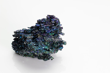 Silicon carbide (carborundum),  shiny and colorful mineral stone from Vesuvius volcano isolated on a white background, Naples, Italy