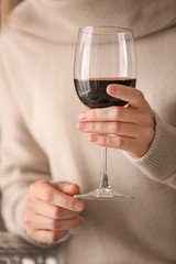 Woman with glass of tasty  wine, closeup